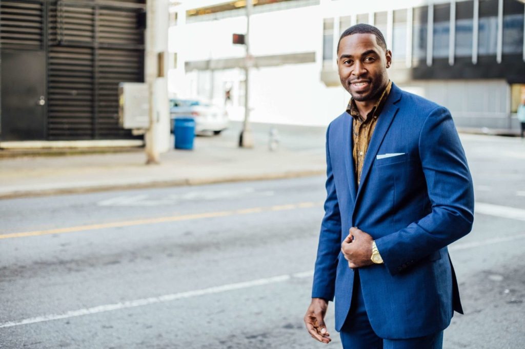 A successful-looking businessman wearing a blue blazer.