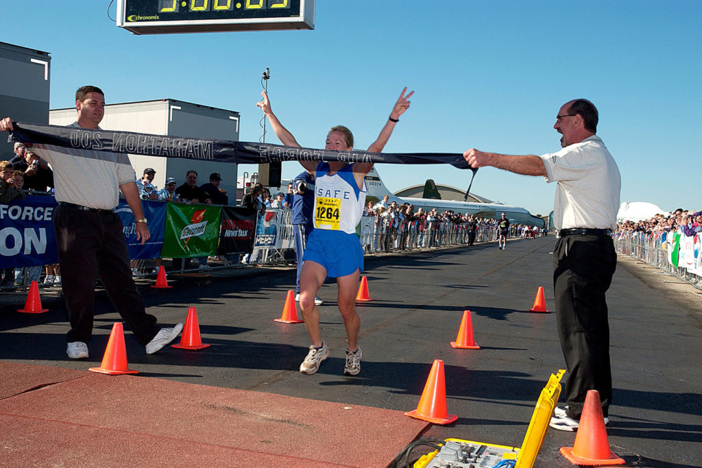 Jill Metzger coming across the finish line to win the Marathon for the female division at Wright-Patterson Air Force Base Marathon for 2004. Start a good habit.