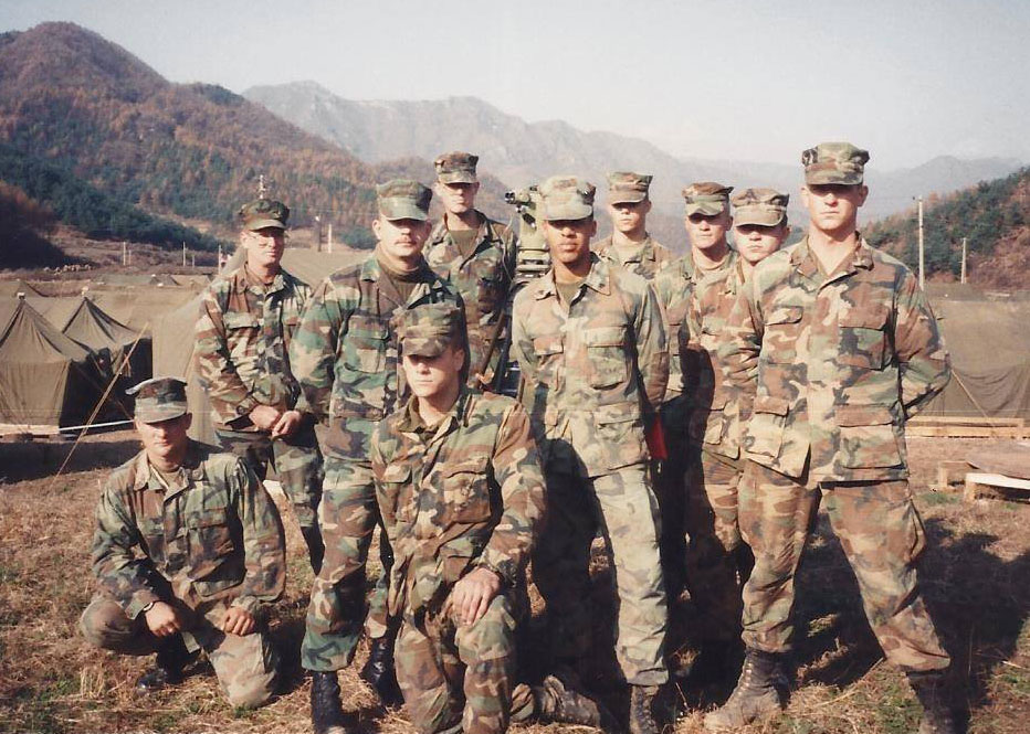 Larry Sharpe in marine uniform with his platoon members.